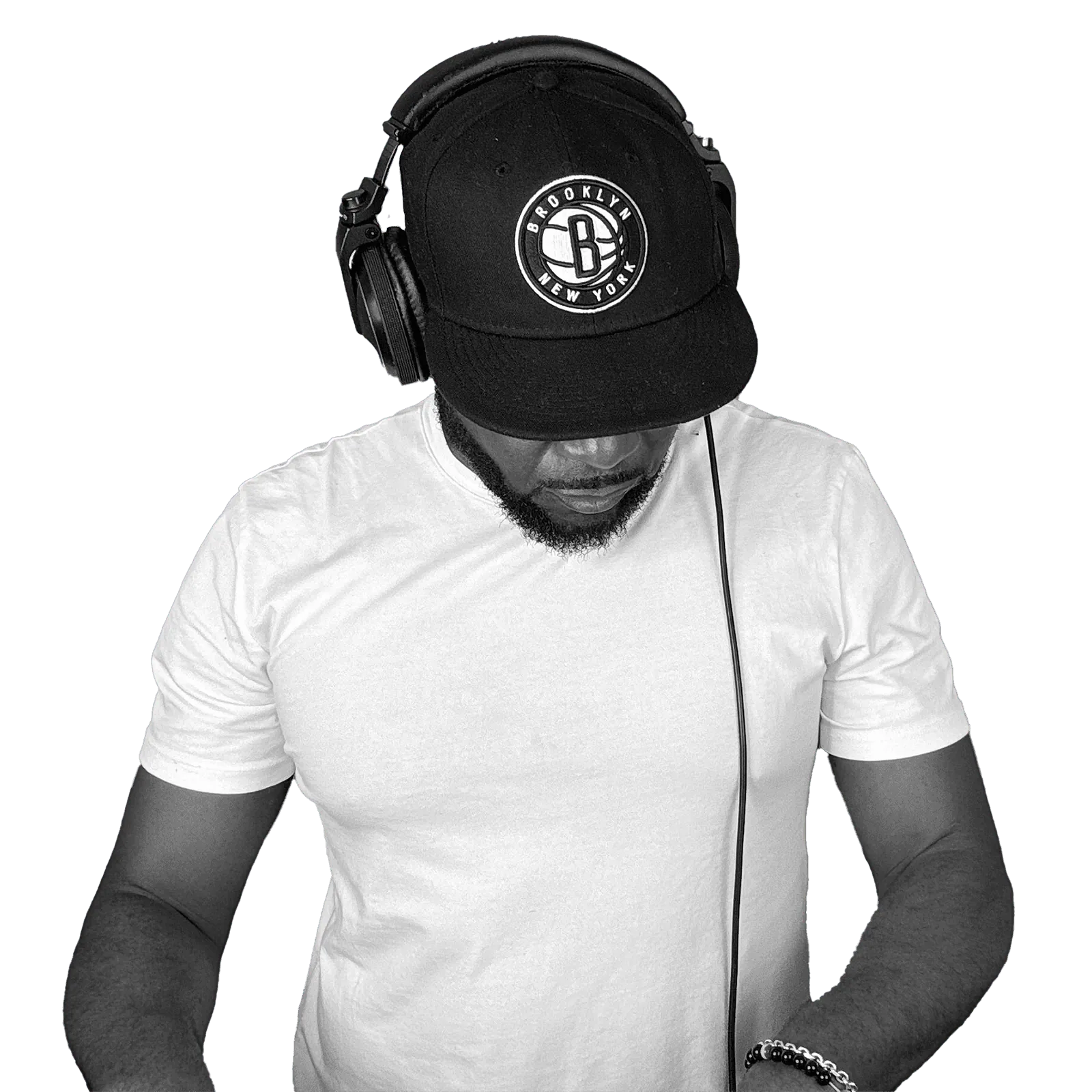 DJ G Power in headphones and a Brooklyn cap